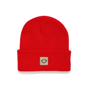 Kids red knit beanie with cute smiley face patch for warm winter fashion and wind protection