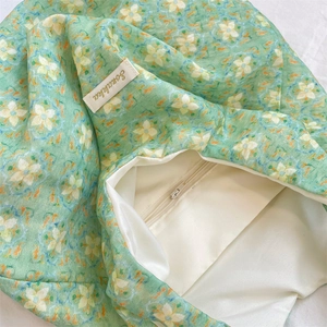 Detail of green floral canvas tote showing Somaleba label and smooth inner lining