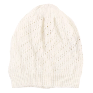 Close-up of white knit hollow out beanie showing detailed wave pattern and ribbed texture