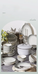 Creamy white ceramic dinnerware set including bowls and plates for oven and microwave