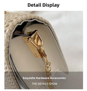 Detailed close-up of woven straw handbag featuring gold metal clasp and white leather trim