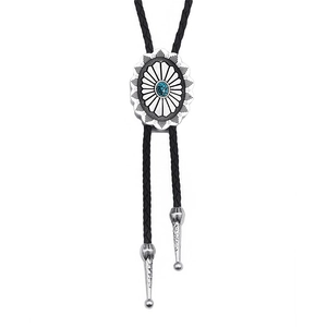 Western style Celtic turquoise bolo tie with silver oval buckle and black braided leather