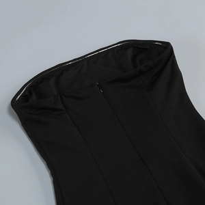 Detail of hidden back zipper and non-slip silicone strip on black mesh dress