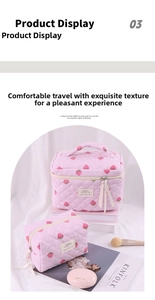 Detailed close-up of strawberry print quilted makeup bag with pink stripes and fabric logo