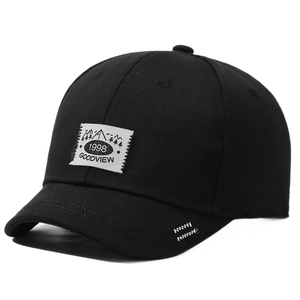 Black short brim baseball cap with vintage patch and decorative stitching for men and women