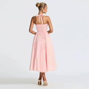 Pink halter neck A-line dress with open back and large bow tie detail in satin finish