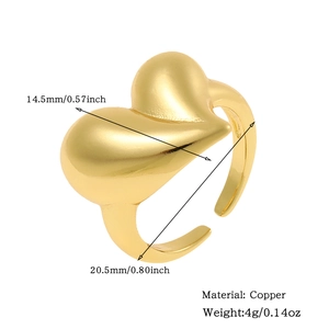 Detail view of gold heart ring dimensions 14.5mm width and copper material specs
