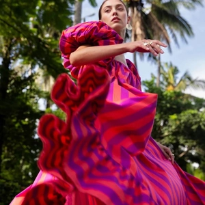 Vibrant orange striped maxi beach dress with puff sleeves and oversized ruffled hemline