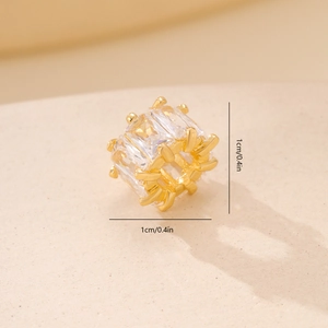 Macro shot of a 1cm gold metal bead with square cubic zirconia for DIY jewelry making