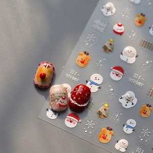 Weihnachts-Nagelsticker mit Weihnachtsmann, Schneeflocken und Rentieren im Detail