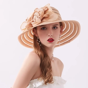 Elegant champagne wide brim sun hat with large floral decoration for summer seaside fashion