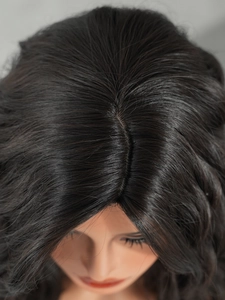 Detailed view of the realistic scalp and hair parting on the black synthetic wig