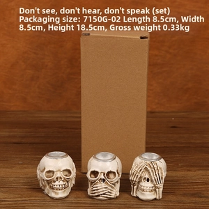 Three set skull candle holders in hear-see-speak no evil pose with gift box packaging