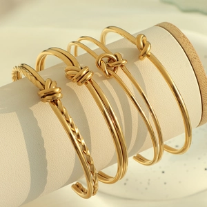 Bracciale rigido aperto in acciaio al titanio vintage francese con design intrecciato