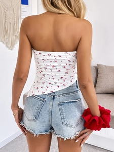Floral tube top with irregular hem and light blue denim shorts in a back view pose