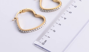 Detailed size measurement of golden heart hoop earrings with sparkling rhinestones
