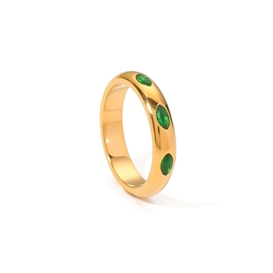 French vintage gold ring with three green marquise-cut emeralds on white background