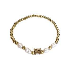 Golden bead and baroque pearl bracelet featuring a minimalist butterfly charm pendant