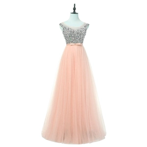 Elegant sleeveless evening gown with silver beaded bodice and layered peach tulle skirt
