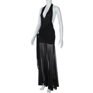 Detail view of the black halter dress featuring mesh patchwork and side waist tie-knot detail