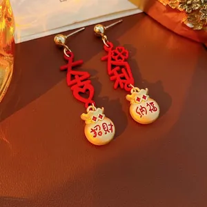 Vintage Chinese lucky charm earrings with red enamel DaJi DaLi characters and gold pouches