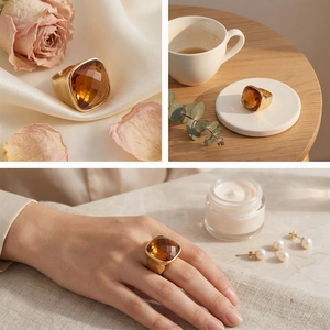 Macro shot of gold stainless steel ring featuring a square amber crystal in a lifestyle setting
