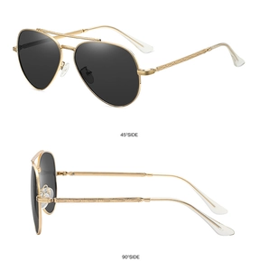 Detail view of gold metal aviator sunglasses with polarized lenses at 45 and 90 degree angles