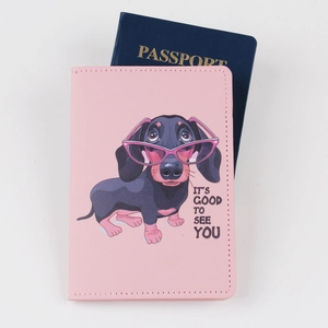 Pink leather passport holder with cartoon dachshund and "IT'S GOOD TO SEE YOU" text