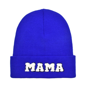 Royal blue winter knit beanie hat for women featuring a white plush MAMA embroidery patch
