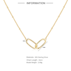 Detailed macro view of S925 sterling silver interlocking double ring necklace pendant