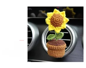Handcrafted crochet sunflower vent clip for car interior decoration with green leaves