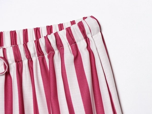 Close-up of burgundy and white vertical striped fabric with elastic waistband detail