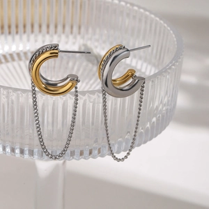 Two-tone 18K gold and silver C-shaped hoop earrings with dangling chain tassels