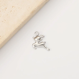 Detail of silver stainless steel reindeer pendant for DIY jewelry making on white background