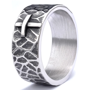 Macro shot of retro silver ring with crocodile texture and raised cross motif details