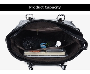 Macro view of the bag's large interior capacity with crocodile pattern leather details