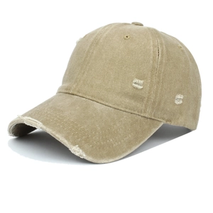 Detailed view of the distressed khaki cotton baseball cap with vintage frayed holes
