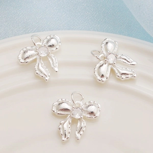 Three silver-plated bow pendants with sparkling cubic zirconia for DIY jewelry making