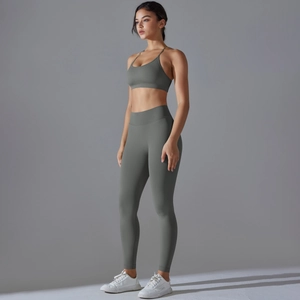 Close-up of seamless dark grey yoga set with sports bra and high-waisted leggings