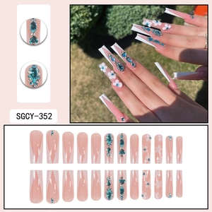 French long ballerina press-on nails with blue rhinestones and white floral patterns