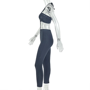 Side view of dark blue high-stretch knitted two-piece sports set on a mannequin