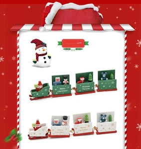 Detail of 4-section wooden Christmas train featuring miniature snowmen and trees