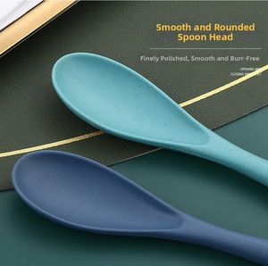 Close-up of smooth wheat straw spoons with matte texture and minimalist round heads