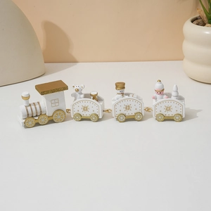 Close-up of painted wooden Christmas train with polar bear and snowman figurines