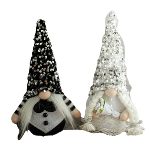 Romantic Nordic bride and groom gnome dolls set with sequins and lace on white background