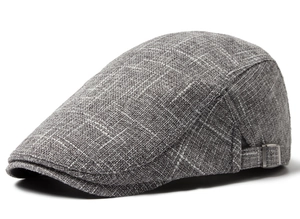 Detail of linen beret with grey textured fabric and adjustable metal side buckle