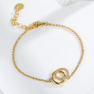 Elegant gold-plated double circle interlocking bracelet with cubic zirconia diamonds