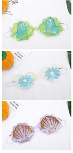 Detailed view of cooling gel eye masks with cute dinosaur, flower and shell designs