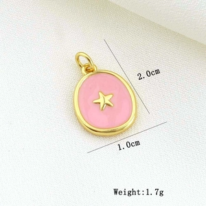 Macro shot of pink enamel oval pendant with gold star, measuring 2.0cm by 1.0cm and 1.7g