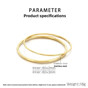 Detail of 18k gold plated 2mm and 3mm stainless steel bangles with mirror finish